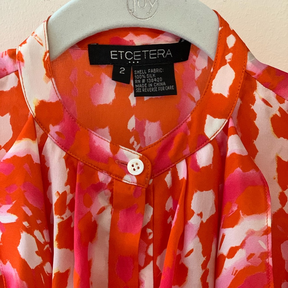 Silk sleeveless blouse with front tie sash